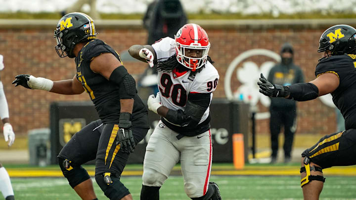 Dec 12, 2020; Columbia, Missouri, USA; Georgia Bulldogs defensive lineman Tramel Walthour (90) rushes the quarterback against offensive linemen Zeke Powell (51) and Xavier Delgado (72) during the second half at Faurot Field at Memorial Stadium. Mandatory Credit: Jay Biggerstaff-USA TODAY Sports
