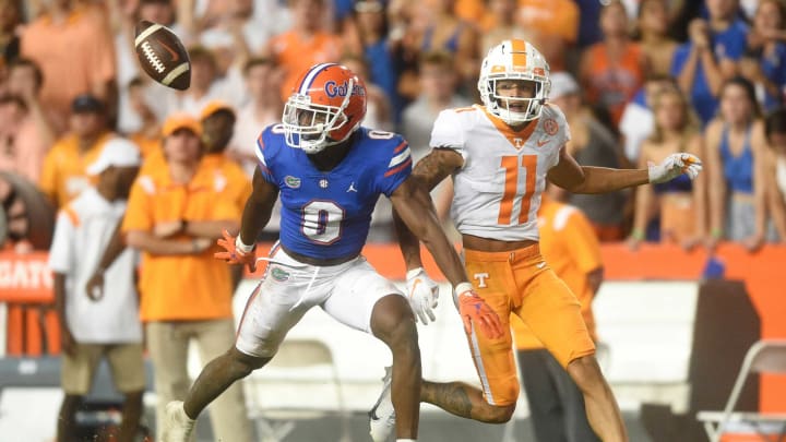 Tennessee wide receiver Jalin Hyatt (11) misses a long pass while defended by Florida safety Trey Dean III (0) during an NCAA football game against Florida at Ben Hill Griffin Stadium in Gainesville, Florida on Saturday, Sept. 25, 2021.Tennflorida0925 2082