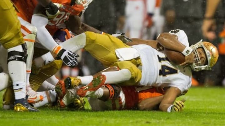 Oct 3, 2015; Clemson, SC, USA; Notre Dame Fighting Irish quarterback DeShone Kizer (14) is tackled by Clemson Tigers linebacker Travis Blanks (11) in the second quarter at Clemson Memorial Stadium. Mandatory Credit: Matt Cashore-USA TODAY Sports