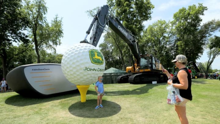 SILVIS, ILLINOIS - JULY 13: Fans take pictures in front of a tractor during the third round of the John Deere Classic at TPC Deere Run on July 13, 2019 in Silvis, Illinois. (Photo by Dylan Buell/Getty Images)