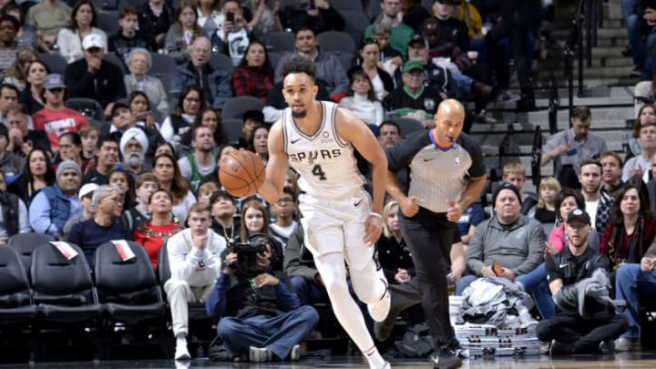 SAN ANTONIO, TX – DECEMBER 31: Derrick White #4 of the San Antonio Spurs handles the ball against the Boston Celtics on December 31, 2018 at the AT&T Center in San Antonio, Texas. NOTE TO USER: User expressly acknowledges and agrees that, by downloading and or using this photograph, user is consenting to the terms and conditions of the Getty Images License Agreement. Mandatory Copyright Notice: Copyright 2018 NBAE (Photos by Mark Sobhani/NBAE via Getty Images)