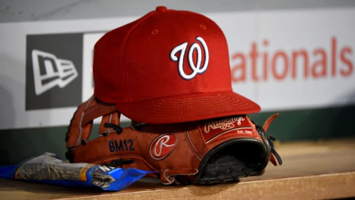 WASHINGTON, DC - SEPTEMBER 25: A general view of a Washington Nationals baseball hat on top of a Rawlings baseball glove during the game against the Philadelphia Phillies at Nationals Park on September 25, 2019 in Washington, DC. (Photo by Will Newton/Getty Images)