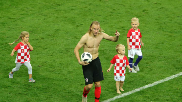 MOSCOW, RUSSIA - JULY 11: Domagoj Vida of Croatia celebrates victory with kids following the 2018 FIFA World Cup Russia Semi Final match between England and Croatia at Luzhniki Stadium on July 11, 2018 in Moscow, Russia. (Photo by Alexander Hassenstein/Getty Images)