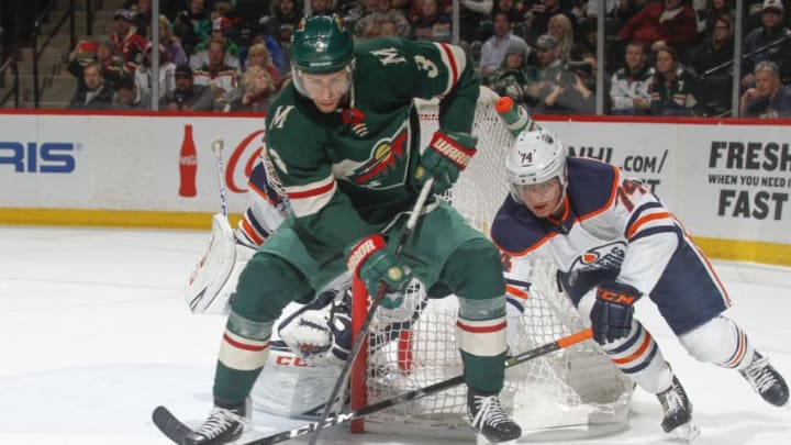 ST. PAUL, MN - APRIL 2: Charlie Coyle #3 of the Minnesota Wild handles the puck with Ethan Bear #74 of the Edmonton Oilers defending during the game at the Xcel Energy Center on April 2, 2018 in St. Paul, Minnesota. (Photo by Bruce Kluckhohn/NHLI via Getty Images)