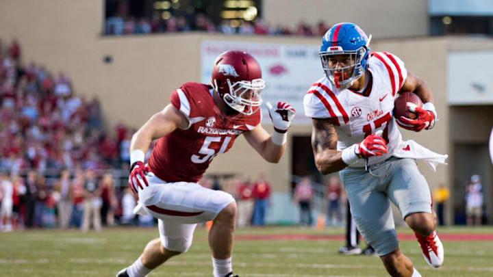 FAYETTEVILLE, AR - OCTOBER15: Evan Engram #17 of the Mississippi Rebels out runs the tackle of Brooks Ellis #51 of the Arkansas Razorbacks for a touchdown at Razorback Stadium on October 15, 2016 in Fayetteville, Arkansas. The Razorbacks defeated the Rebels 34-30. (Photo by Wesley Hitt/Getty Images)