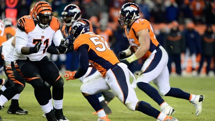 Dec 28, 2015; Denver, CO, USA; Denver Broncos outside linebacker Von Miller (58) pass rushes at Cincinnati Bengals tackle Andre Smith (71) in a overtime quarter at Sports Authority Field at Mile High. The Broncos defeated the Cincinnati Bengals 20-17 in overtime. Mandatory Credit: Ron Chenoy-USA TODAY Sports
