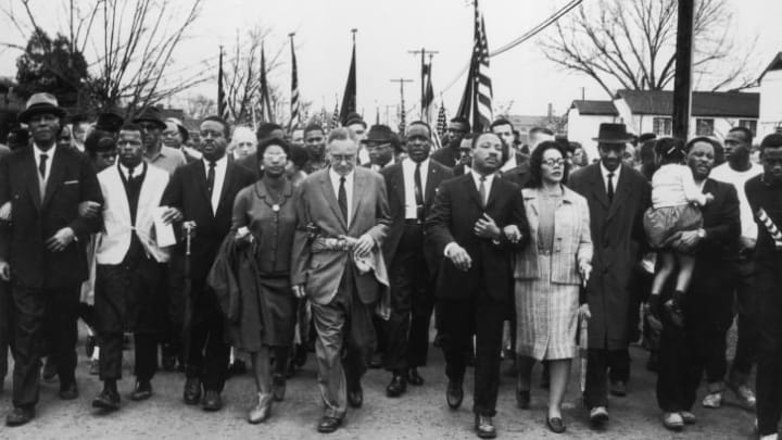 Martin Luther King Jr. and his wife, Coretta Scott King, lead a black voting rights march from Selma, Alabama, to the state capital in Montgomery in March 1965.