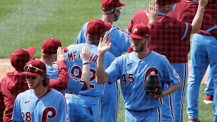 PHILADELPHIA, PENNSYLVANIA - MAY 06: Zack Wheeler #45 of the Philadelphia Phillies (R) celebrates with teammates (Photo by Tim Nwachukwu/Getty Images)