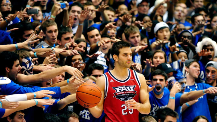 DURHAM, NC – NOVEMBER 15: Duke Blue Devils fans taunt Pablo Bertone #25 of the Florida Atlantic Owls as he prepares to inbound the ball during play at Cameron Indoor Stadium on November 15, 2013 in Durham, North Carolina. Duke won 97-64. (Photo by Grant Halverson/Getty Images)