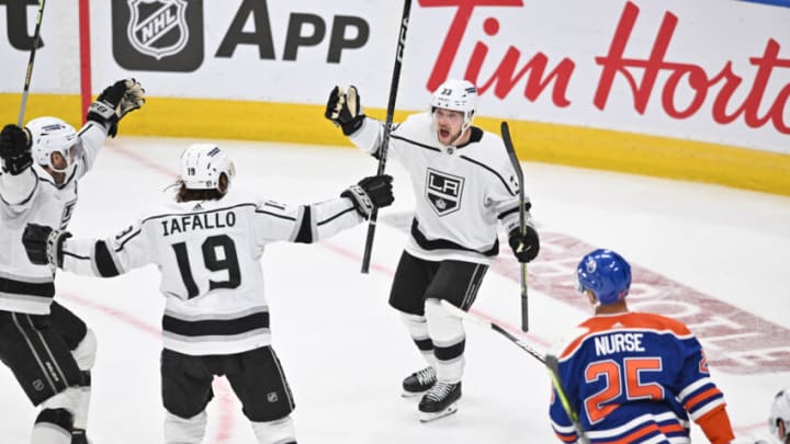 Apr 17, 2023; Edmonton, Alberta, CAN; Los Angeles Kings left winger Alex Iafallo (19 ) along with Kings right winger Viktor Arvidsson (33) celebrate their game-winning goal in overtime against the Edmonton Oilers in the first round of the 2023 Stanley Cup Playoffs at Rogers Place. Los Angeles Kings won the game 4-3. Mandatory Credit: Walter Tychnowicz-USA TODAY Sports