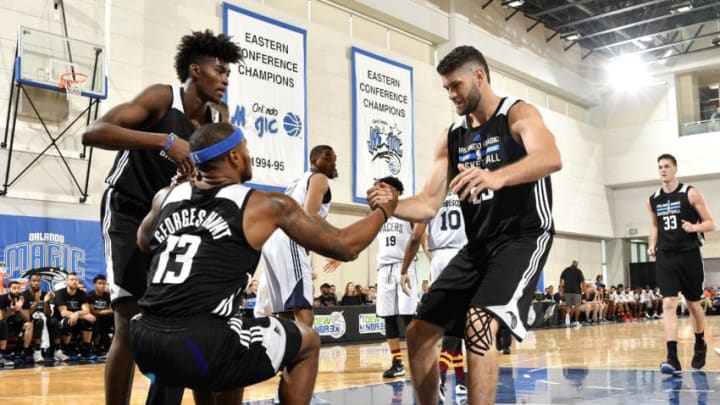 ORLANDO, FL - JULY 1: Jonathan Isaac #1 and Patricio Garino #29 help up Marcus Georges-Hunt #13 of the Orlando Magic during the game against the Indiana Pacers during the 2017 Orlando Summer League on July 1, 2017 at Amway Center in Orlando, Florida. NOTE TO USER: User expressly acknowledges and agrees that, by downloading and or using this photograph, User is consenting to the terms and conditions of the Getty Images License Agreement. Mandatory Copyright Notice: Copyright 2015 NBAE (Photo by Fernando Medina/NBAE via Getty Images)