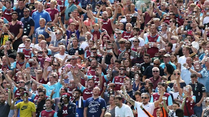 West Ham fans cheer as bubbles fill the air before the kick off of the pre-season friendly football match between West Ham United and Juventus at the London Stadium in east London on August 7, 2016. / AFP / JUSTIN TALLIS (Photo credit should read JUSTIN TALLIS/AFP/Getty Images)