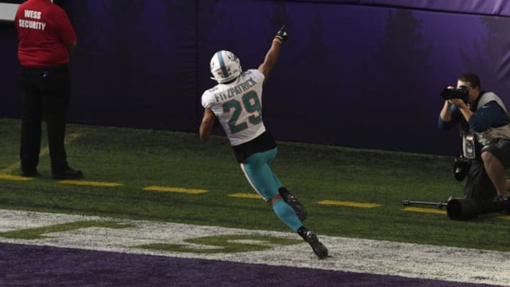MINNEAPOLIS, MN - DECEMBER 16: Minkah Fitzpatrick #29 of the Miami Dolphins celebrates scoring a touchdown after intercepting a pass by Kirk Cousins #8 of the Minnesota Vikings in the second quarter of the game at U.S. Bank Stadium on December 16, 2018 in Minneapolis, Minnesota. Fitzpatrick scored a 50 yard touchdown on the play. (Photo by Hannah Foslien/Getty Images)
