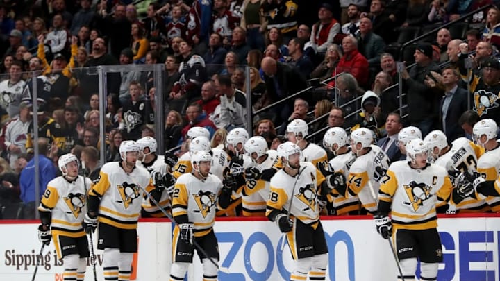 DENVER, CO - NOVEMBER 28: Sidney Crosby #87 of the Pittsburgh Penguins and his teammates celebrate his first goal against the Colorado Avalanche in the second period at the Pepsi Center on November 28, 2018 in Denver, Colorado. (Photo by Matthew Stockman/Getty Images)