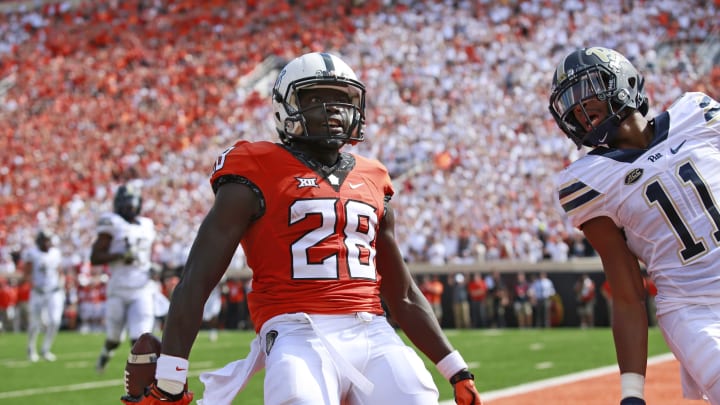 STILLWATER, OK – SEPTEMBER 17 : Wide receiver James Washington #28 of the Oklahoma State Cowboys looks to the crowd after scoring in front of defensive back Dane Jackson #11 of the Pittsburgh Panthers September 17, 2016 at Boone Pickens Stadium in Stillwater, Oklahoma. (Photo by Brett Deering/Getty Images)