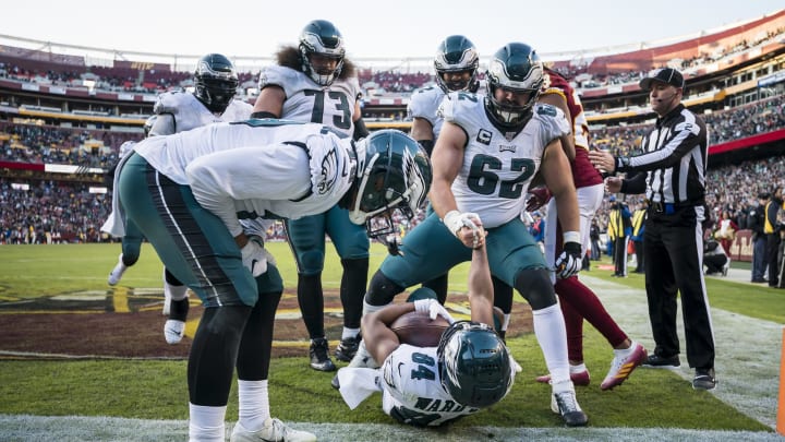 LANDOVER, MD – DECEMBER 15: Greg Ward #84 of the Philadelphia Eagles is helped up by Jason Kelce #62 after scoring the game-winning touchdown against the Washington Redskins during the second half at FedExField on December 15, 2019, in Landover, Maryland. (Photo by Scott Taetsch/Getty Images)