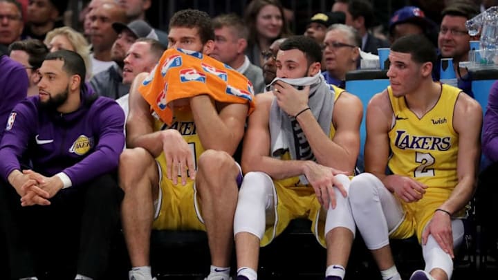 NEW YORK, NY - DECEMBER 12: Brook Lopez #11 (L), Larry Nance Jr. #7 and Lonzo Ball #2 of the Los Angeles Lakers react from the bench in the fourth quarter against the New York Knicks during their game at Madison Square Garden on December 12, 2017 in New York City. NOTE TO USER: User expressly acknowledges and agrees that, by downloading and or using this photograph, User is consenting to the terms and conditions of the Getty Images License Agreement. (Photo by Abbie Parr/Getty Images)