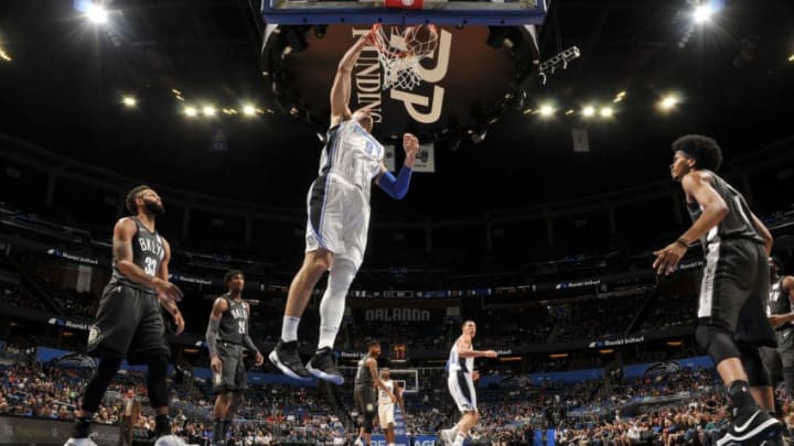 ORLANDO, FL - MARCH 28: Nikola Vucevic #9 of the Orlando Magic dunks the ball against the Brooklyn Nets on March 28, 2018 at Amway Center in Orlando, Florida. NOTE TO USER: User expressly acknowledges and agrees that, by downloading and or using this photograph, User is consenting to the terms and conditions of the Getty Images License Agreement. Mandatory Copyright Notice: Copyright 2018 NBAE (Photo by Fernando Medina/NBAE via Getty Images)