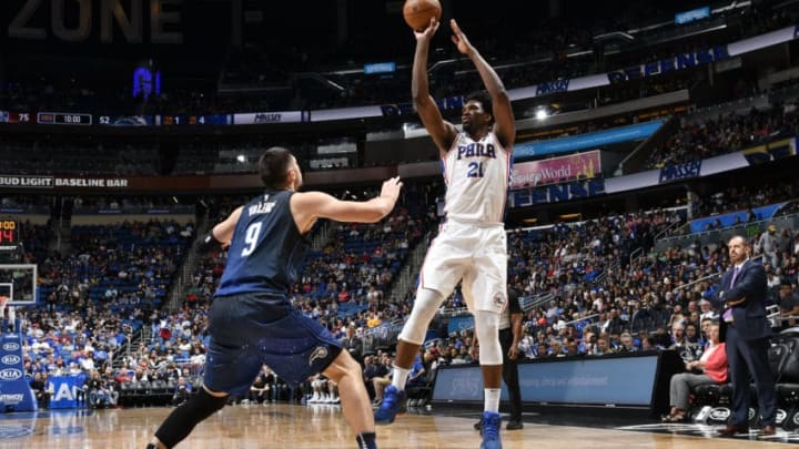 ORLANDO, FL - MARCH 22: Joel Embiid #21 of the Philadelphia 76ers shoots the ball against the Orlando Magic on March 22, 2018 at Amway Center in Orlando, Florida. NOTE TO USER: User expressly acknowledges and agrees that, by downloading and or using this photograph, User is consenting to the terms and conditions of the Getty Images License Agreement. Mandatory Copyright Notice: Copyright 2018 NBAE (Photo by Fernando Medina/NBAE via Getty Images)