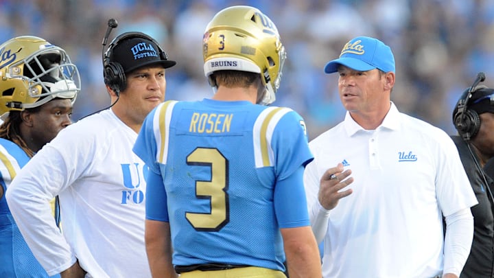 September 10, 2016; Pasadena, CA, USA; UCLA Bruins quarterback Josh Rosen (3) speaks with head coach Jim Mora and offensive coordinator Kennedy Polamalu after a touchdown scored against the UNLV Rebels during the first half at Rose Bowl. Mandatory Credit: Gary A. Vasquez-USA TODAY Sports