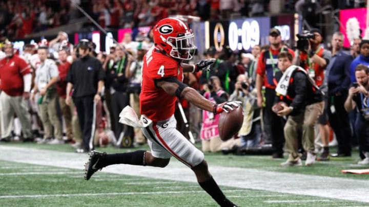 ATLANTA, GA - JANUARY 08: Mecole Hardman #4 of the Georgia Bulldogs runs one yard for a touchdown during the second quarter against the Alabama Crimson Tide in the CFP National Championship presented by AT&T at Mercedes-Benz Stadium on January 8, 2018 in Atlanta, Georgia. (Photo by Jamie Squire/Getty Images)