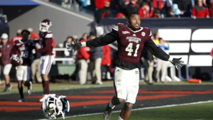 JACKSONVILLE, FL - DECEMBER 30: Mark McLaurin #41 of the Mississippi State Bulldogs reacts as time runs out in the fourth quarter of the TaxSlayer Bowl against the Louisville Cardinals at EverBank Field on December 30, 2017 in Jacksonville, Florida. The Bulldogs won 31-27. (Photo by Joe Robbins/Getty Images)