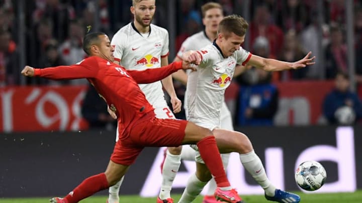 Bayern Munich's Spanish midfielder Thiago Alcantara (L) and Leipzig's Spanish midfielder Dani Olmo vie for the ball during the German first division Bundesliga football match FC Bayern Munich v RB Leipzig in Munich, southern Germany, on February 9, 2020. (Photo by THOMAS KIENZLE / AFP) / RESTRICTIONS: DFL REGULATIONS PROHIBIT ANY USE OF PHOTOGRAPHS AS IMAGE SEQUENCES AND/OR QUASI-VIDEO (Photo by THOMAS KIENZLE/AFP via Getty Images)