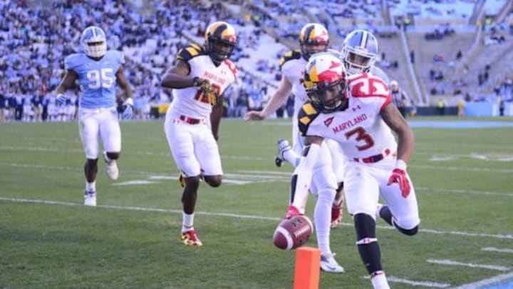 Nov 24, 2012; Chapel Hill, NC, USA; Maryland Terrapins wide receiver Nigel King (3) scores a touchdown as wide receiver Kevin Dorsey (12) and offensive linesman Mike Madaras (77) block and North Carolina Tar Heels defensive end Kareem Martin (95) and North Carolina Tar Heels cornerback Tim Scott (7) defend in the first quarter at Kenan Stadium. Mandatory Credit: Bob Donnan-USA TODAY Sports Nov 24, 2012; Chapel Hill, NC, USA; Maryland Terrapins wide receiver Nigel King (3) scores a touchdown as wide receiver Kevin Dorsey (12) and offensive linesman Mike Madaras (77) block and North Carolina Tar Heels defensive end Kareem Martin (95) and North Carolina Tar Heels cornerback Tim Scott (7) defend in the first quarter at Kenan Stadium. Mandatory Credit: Bob Donnan-USA TODAY Sports