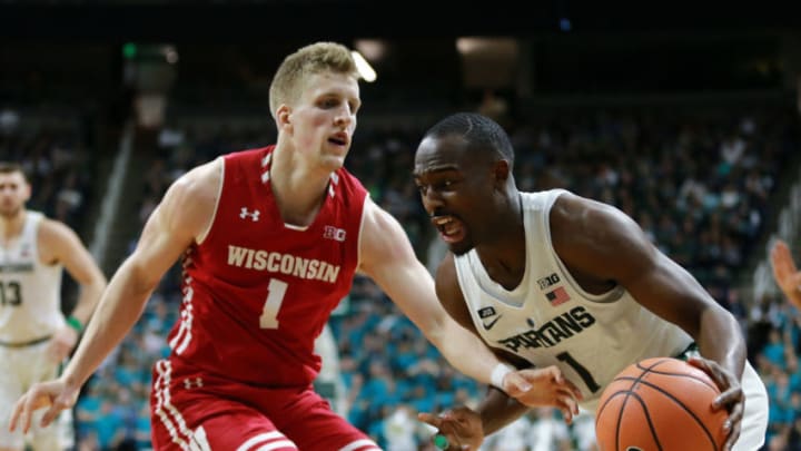 EAST LANSING, MI - JANUARY 26: Joshua Langford #1 of the Michigan State Spartans drives to the basket while defended by Brevin Pritzl #1 of the Wisconsin Badgers at Breslin Center on January 26, 2018 in East Lansing, Michigan. (Photo by Rey Del Rio/Getty Images)