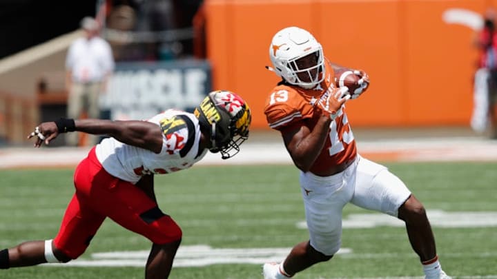 AUSTIN, TX - SEPTEMBER 02: Jerrod Heard #13 of the Texas Longhorns runs the ball defended by Antwaine Richardson #20 of the Maryland Terrapins in the third quarter at Darrell K Royal-Texas Memorial Stadium on September 2, 2017 in Austin, Texas. (Photo by Tim Warner/Getty Images) AUSTIN, TX - SEPTEMBER 02: Jerrod Heard #13 of the Texas Longhorns runs the ball defended by Antwaine Richardson #20 of the Maryland Terrapins in the third quarter at Darrell K Royal-Texas Memorial Stadium on September 2, 2017 in Austin, Texas. (Photo by Tim Warner/Getty Images)