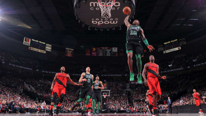 PORTLAND, OR - MARCH 23: Terry Rozier #12 of the Boston Celtics goes to the basket against the Portland Trail Blazers on March 23, 2018 at the Moda Center in Portland, Oregon. NOTE TO USER: User expressly acknowledges and agrees that, by downloading and or using this Photograph, user is consenting to the terms and conditions of the Getty Images License Agreement. Mandatory Copyright Notice: Copyright 2018 NBAE (Photo by Sam Forencich/NBAE via Getty Images)