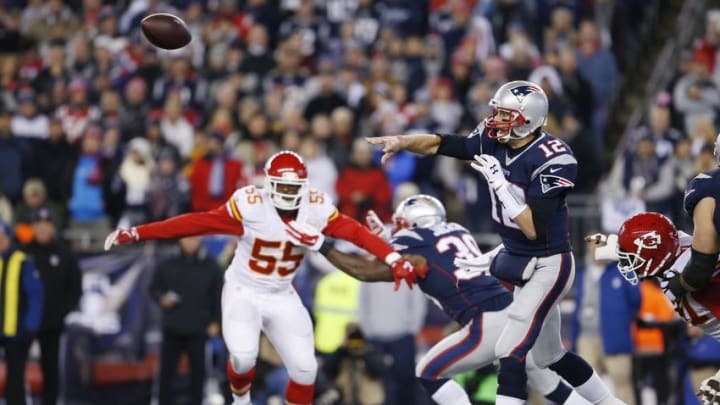 Jan 16, 2016; Foxborough, MA, USA; New England Patriots quarterback Tom Brady (12) throws the ball in front of Kansas City Chiefs outside linebacker Dee Ford (55) during the first half in the AFC Divisional round playoff game at Gillette Stadium. Mandatory Credit: David Butler II-USA TODAY Sports