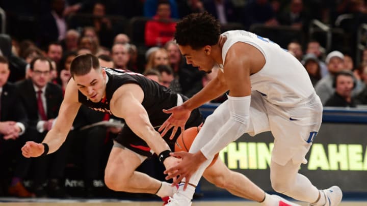 NEW YORK, NY - DECEMBER 20: Tre Jones #3 of the Duke Blue Devils and Matt Mooney #13 of the Texas Tech Red Raiders chase a loose ball during the first half of the game at the Ameritas Insurance Classic at Madison Square Garden on December 20, 2018 in New York City. (Photo by Sarah Stier/Getty Images)