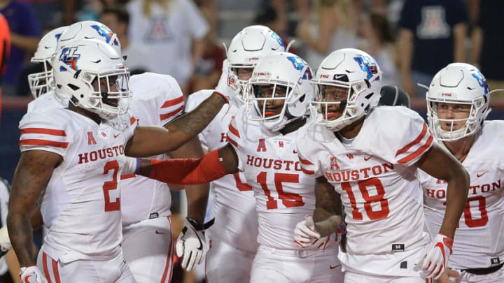TUCSON, AZ - SEPTEMBER 09: Wide receiver Linell Bonner #15 of the Houston Cougars celebrates with Duke Catalon #2 and Keith Corbin #18 after scoring a five yard touchdown against the Arizona Wildcats in the first half at Arizona Stadium on September 9, 2017 in Tucson, Arizona. (Photo by Jennifer Stewart/Getty Images)