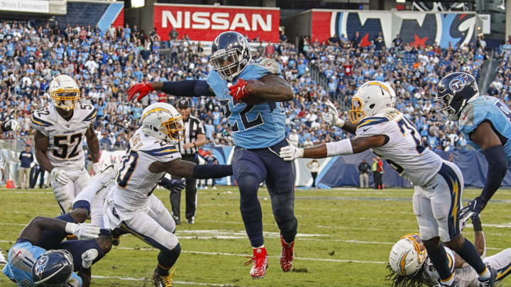 NASHVILLE, TENNESSEE – OCTOBER 20: Derrick Henry #22 of the Tennessee Titans breaks through the grasp of two Los Angeles Chargers to score a touchdown during the second half at Nissan Stadium on October 20, 2019 in Nashville, Tennessee. (Photo by Frederick Breedon/Getty Images)