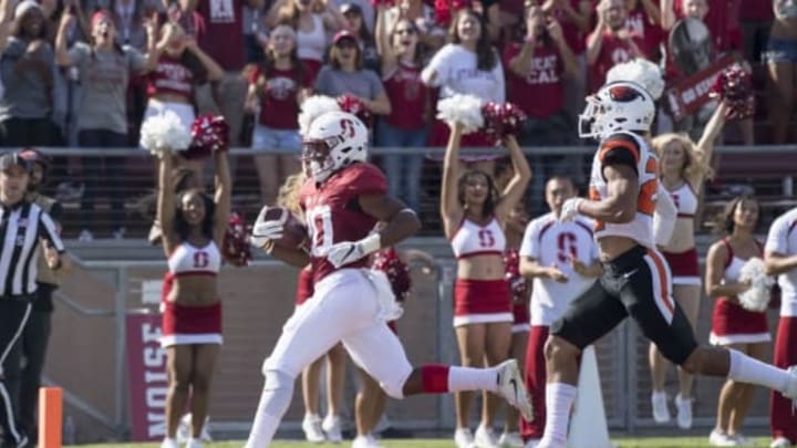 November 5, 2016; Stanford, CA, USA; Stanford Cardinal running back Bryce Love (20) scores a touchdown Oregon State Beavers cornerback Xavier Crawford (22) during the first quarter at Stanford Stadium. Mandatory Credit: Kyle Terada-USA TODAY Sports