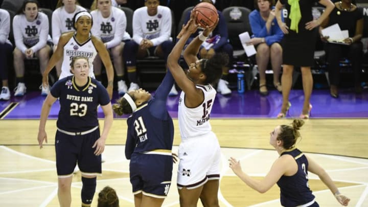 COLUMBUS, OH - APRIL 1: Kristina Nelson #21 of the Notre Dame Fighting Irish makes contact as Teaira McCowan #15 of the Mississippi State Bulldogs attempts a jump shot during the championship game of the 2018 NCAA Division I Women's Basketball Final Four at Nationwide Arena in Columbus, Ohio. (Photo by Tim Nwachukwu/NCAA Photos via Getty Images)