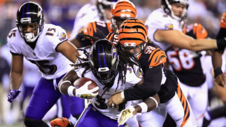 CINCINNATI, OH – SEPTEMBER 13: Nick Vigil #59 of the Cincinnati Bengals tackles Alex Collins #34 of the Baltimore Ravens during the first half at Paul Brown Stadium on September 13, 2018 in Cincinnati, Ohio. (Photo by Andy Lyons/Getty Images)