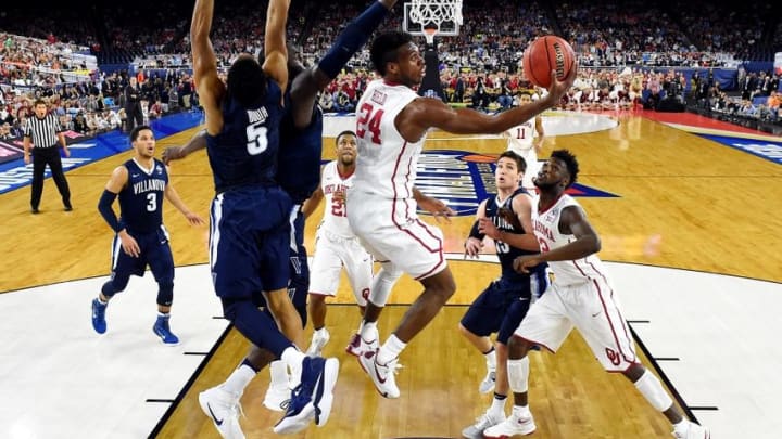 Apr 2, 2016; Houston, TX, USA; Oklahoma Sooners guard Buddy Hield (24) shoots the ball against Villanova Wildcats guard Phil Booth (5) during the first half in the 2016 NCAA Men