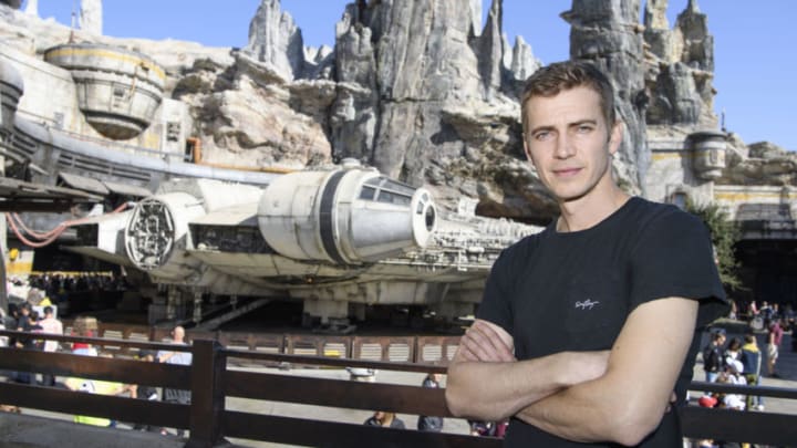Actor Hayden Christensen poses in front of the Millennium Falcon: Smugglers Run in Star Wars: Galaxy's Edge while vacationing at Disneyland Park