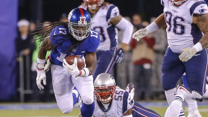 Nov 15, 2015; East Rutherford, NJ, USA; New York Giants wide receiver Dwayne Harris (17) breaks away from New England Patriots middle linebacker Jonathan Freeny (55) during the second quarter at MetLife Stadium. Mandatory Credit: Jim O