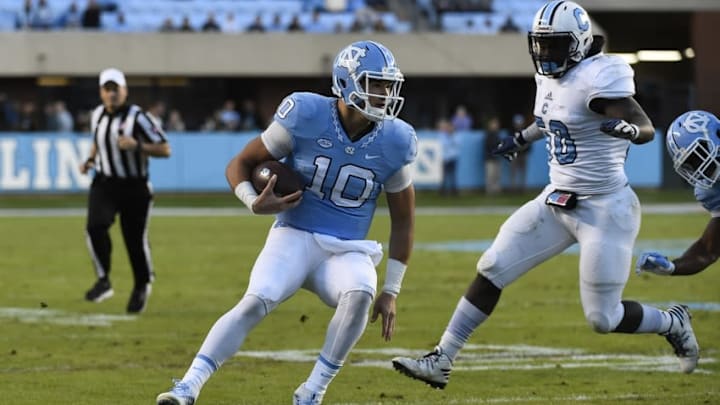 Nov 19, 2016; Chapel Hill, NC, USA; North Carolina Tar Heels quarterback Mitch Trubisky (10) with the ball as Citadel Bulldogs linebacker Myles Pierce (50) defends in the second quarter at Kenan Memorial Stadium. Mandatory Credit: Bob Donnan-USA TODAY Sports