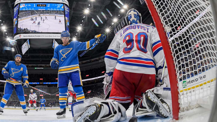 aden Schwartz #17 of the St. Louis Blues celebrates after the puck goes by Henrik Lundqvist #30 of the New York Rangers