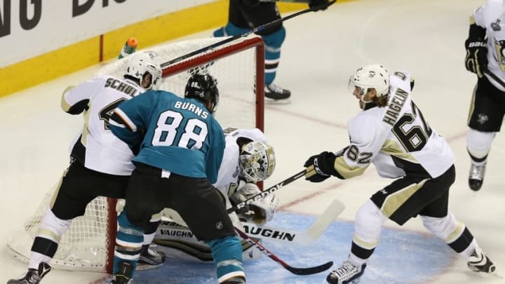 Jun 4, 2016; San Jose, CA, USA; Pittsburgh Penguins goalie Matt Murray (30) makes a save on the puck as Pdefenseman Justin Schultz (4) and left wing Carl Hagelin (62) try to keep San Jose Sharks defenseman Brent Burns (88) from the crease in the second period of game three of the 2016 Stanley Cup Final at SAP Center at San Jose. Mandatory Credit: John Hefti-USA TODAY Sports