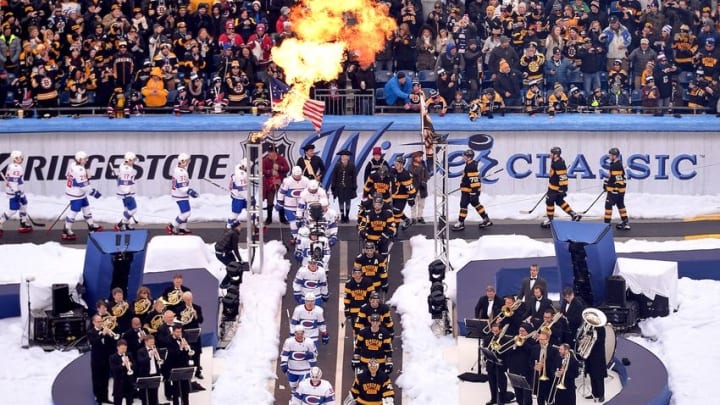 Jan 1, 2016; Foxborough, MA, USA; The Boston Bruins and the Montreal Canadiens walk past the Boston Pops Orchestra towards the ice before the start of the Winter Classic hockey game at Gillette Stadium. Mandatory Credit: Brian Fluharty-USA TODAY Sports