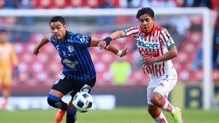 Pablo Barrera(left) and Queretaro will try to focus on Necaxa as the Liga MX resumes play after a brief suspension. (Photo by Hector Vivas/Getty Images)