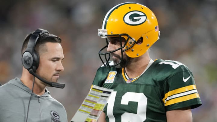 GREEN BAY, WISCONSIN - OCTOBER 02: Head coach Matt LaFleur of the Green Bay Packers talks to Aaron Rodgers #12 of the Green Bay Packers during overtime against the New England Patriots at Lambeau Field on October 02, 2022 in Green Bay, Wisconsin. (Photo by Patrick McDermott/Getty Images)
