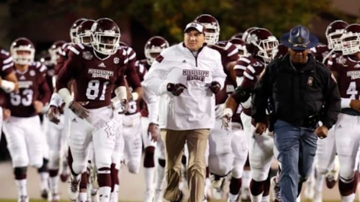 Nov 1, 2014; Starkville, MS, USA; Mississippi State Bulldogs head coach Dan Mullen brings his team onto the field prior to the game against the Arkansas Razorbacks at Davis Wade Stadium. The Bulldogs defeat the Razorbacks 17-10. Mandatory Credit: Marvin Gentry-USA TODAY Sports