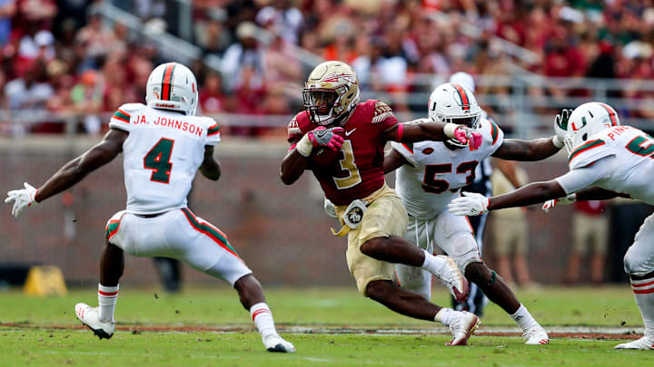 TALLAHASSEE, FL – OCTOBER 7: Running back Cam Akers #3 of the Florida State Seminoles carries the ball as defensive back Jaquan Johnson #4 of the Miami Hurricanes tries to tackle him during the first half of an NCAA football game at Doak S. Campbell Stadium on October 7, 2017 in Tallahassee, Florida. (Photo by Butch Dill/Getty Images)