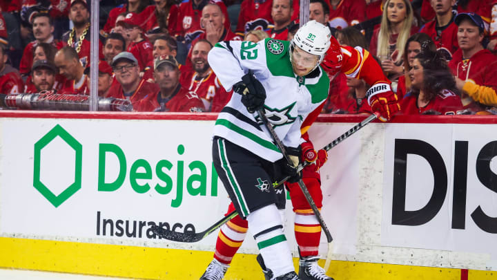 May 15, 2022; Calgary, Alberta, CAN; Dallas Stars center Vladislav Namestnikov (92) battle for the puck during the third period against the Calgary Flames in game seven of the first round of the 2022 Stanley Cup Playoffs at Scotiabank Saddledome. Mandatory Credit: Sergei Belski-USA TODAY Sports